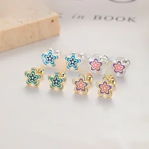 Macro detail of 925 silver flower stud earrings with enamel petals and screw-back closure