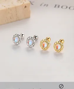 Macro shot of 925 silver moonstone stud earrings with twisted rope border design