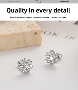 Detail of 925 sterling silver snowflake stud earrings with sparkling cubic zirconia stones