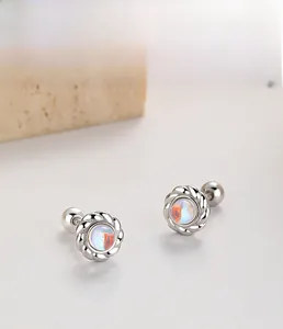 Macro shot of 925 sterling silver flower earrings with iridescent moonstone and screw backs