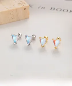Detail of S925 silver heart-shaped moonstone stud earrings with elegant iridescent sheen