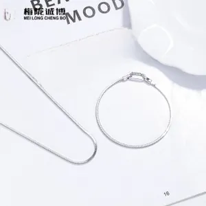Detailed view of glossy 925 sterling silver snake chain necklace and bracelet set