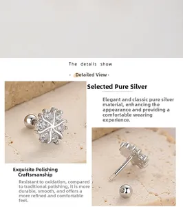 Macro detail of 925 sterling silver snowflake stud with zircon inlay and screw back