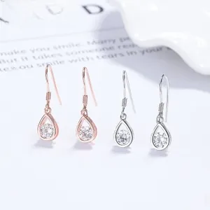 Detail of S925 sterling silver teardrop hook earrings with sparkling cubic zirconia stones