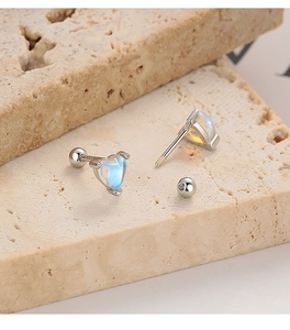 Detailed view of S925 hallmark on heart moonstone screw back earring with silver texture