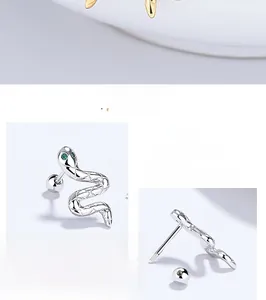 Detail view of 925 sterling silver snake stud earrings with green zircon eyes and screw back