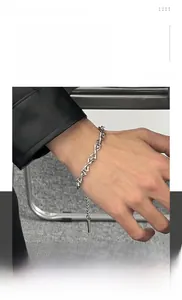 Detail of titanium steel hip hop bracelet with interlocking V-shaped geometric links