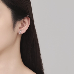 S925 sterling silver snake stud earring worn by a model in a minimalist style