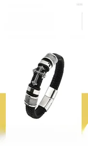 Close-up of hip hop braided leather bracelet with a silver cross and titanium steel buckle