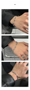 Close-up of silver geometric triangle link bracelet with industrial punk style