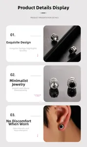 Vue détaillée de clous d'oreilles magnétiques en zircon noir et blanc au fini galvanisé
