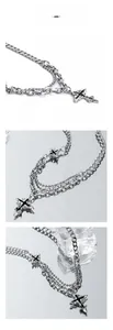 Close-up of layered silver necklace with punk cross pendant and mixed chain textures