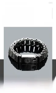 Detailed view of titanium steel chain bracelet with retro totem engraved buckle