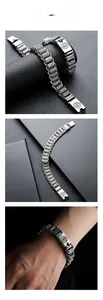 Macro detail of retro stainless steel bracelet with Six-Syllable Mantra engraving