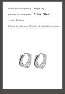 Detail of twisted titanium steel hoop earrings in steel color weighing nine grams
