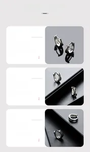 Detailed view of irregular geometric silver hoop earrings with a mirror polished finish