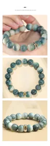 Detail of hand-carved natural bodhi beads bracelet with vintage metal spacer charm