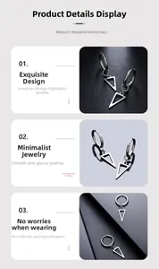 Macro detail of geometric triangle earrings featuring high-polish finish and hip-hop design