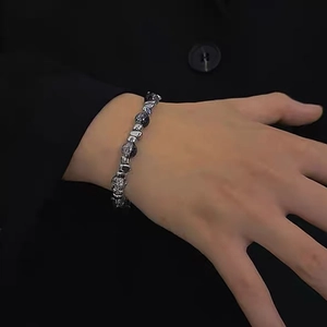 Unisex beaded bracelet with silver metallic beads and dark translucent gemstones
