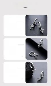 Detailed close-up of silver double cross earrings with sparkling cubic zirconia inlay