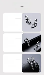 Detail view of silver cross earrings with zircon stones and tassel chains for men and women