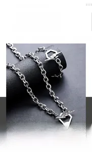Close-up of hip hop lightning pendant necklace on display with stainless steel chain