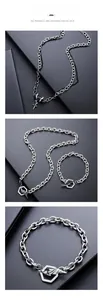 Industrial style silver chain set with black gemstone pendant and cross detail view