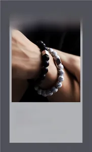 Macro shot of lava stone and marble beaded bracelet set with silver geometric metal accents