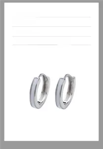 Detail of silver hoop earrings with white enamel inlay for men and women