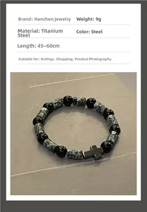 Detail of titanium steel beaded bracelet with cross pendant and vintage textured beads