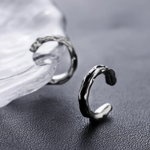 Sleek minimalist silver ear cuff with liquid metal texture for a modern hip hop style