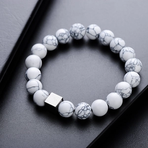 Volcanic stone bracelet with white marble beads and a silver geometric cube bead