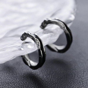 Minimalist lava texture C-shaped clip-on earrings with industrial black metal finish