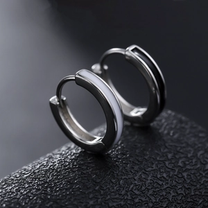 Sleek stainless steel hoop earrings with black and white enamel inlay for unisex style