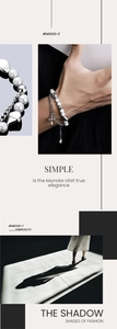 Detail of layered cross bracelet with white beads and titanium steel metal links