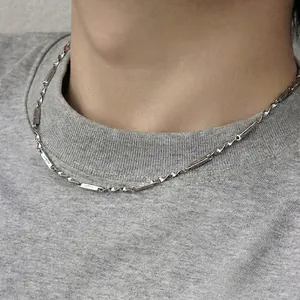 Mobius necklace with star engraved bars and twisted silver chain on a model