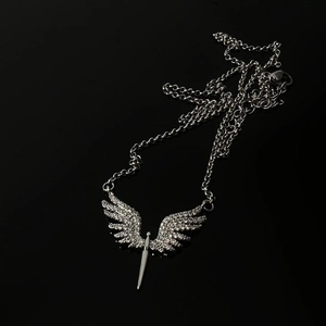 Hip hop silver angel wing necklace with crystal inlay on a black reflective background