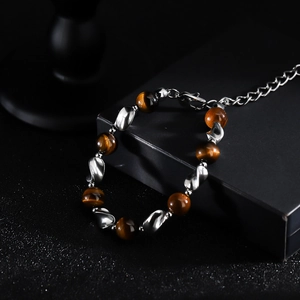 Tiger eye bead bracelet with silver twisted metal links and adjustable lobster clasp