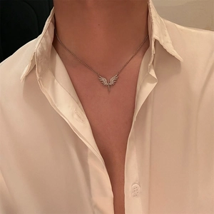 Hip hop angel wing necklace for men and women featuring sparkling pavé stones