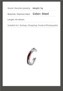 Detail of steel ear cuff with irregular texture and red enamel finish weight 9g