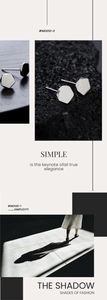 Macro view of geometric silver stud earrings on volcanic rock and lifestyle shadow shot