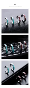 Detail of irregular wave texture ear clips with blue and deep red enamel finish