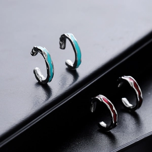 Irregular textured silver ear cuffs in lake blue and deep red lava finish for unisex wear