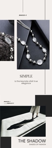 Macro view of opal stone necklace with silver metal chain showing elegant design