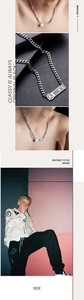 Detail of silver Cuban chain necklace with HANCHEN logo pendant and urban street style