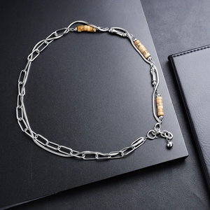 Dual-layer titanium steel necklace featuring chunky links and beaded snake chain