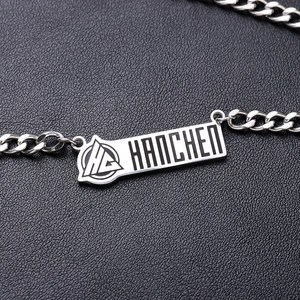 Polished titanium steel curb chain necklace with a rectangular engraved brand tag
