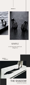 Gros plan de créoles géométriques noires minimalistes avec texture métallique polie