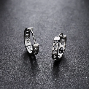 Polished silver hoop earrings with geometric cutout design and secure hinge closure