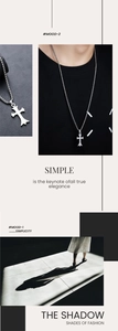 Detail view of silver irregular cross pendant with pearl chain on leather background